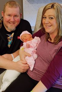 Mila Scherreiks with parents Nick and Megan Scherreiks