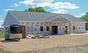 The Tomah Health Occupational Health & Wellness Clinic under construction on a sunny day