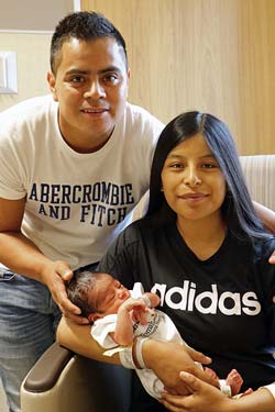 Mom and Dad pose with the last baby born at Tomah Memorial Hospital