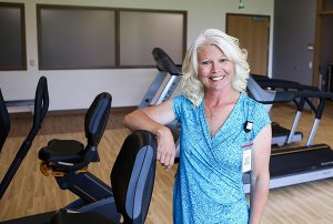 Shana Steele standing in a gym with rehab therapy equipment