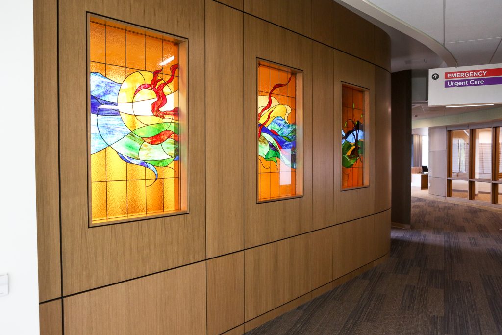 A wall with stained glass windows in a hospital