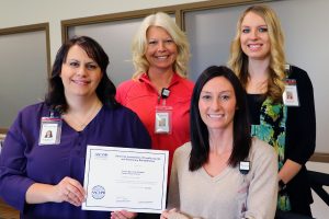 Members of the Cardiac Rehabilitation staff at Tomah Health pose with a certificate of certification