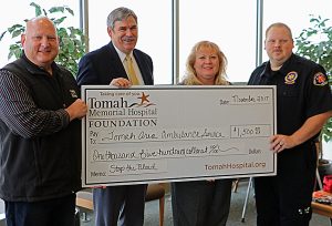 Tomah Health Foundation presents a ceremonial check to the Tomah Area Ambulance Service