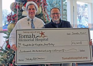 Tomah Health presents a ceremonial check to Tomah Neighbor for Neighbor Food Pantry