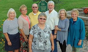 The former Tomah Health Hospice Touch & Life Choices Palliative Care director poses front and center at the dedication where she was honored.