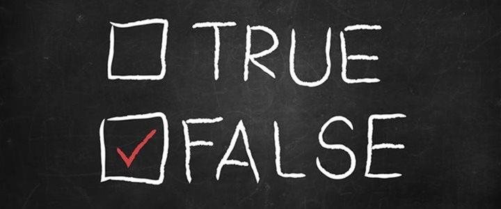 A chalkboard with True and False written on it, with a check mark next to False