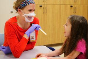 Speech Therapist working with child paitent