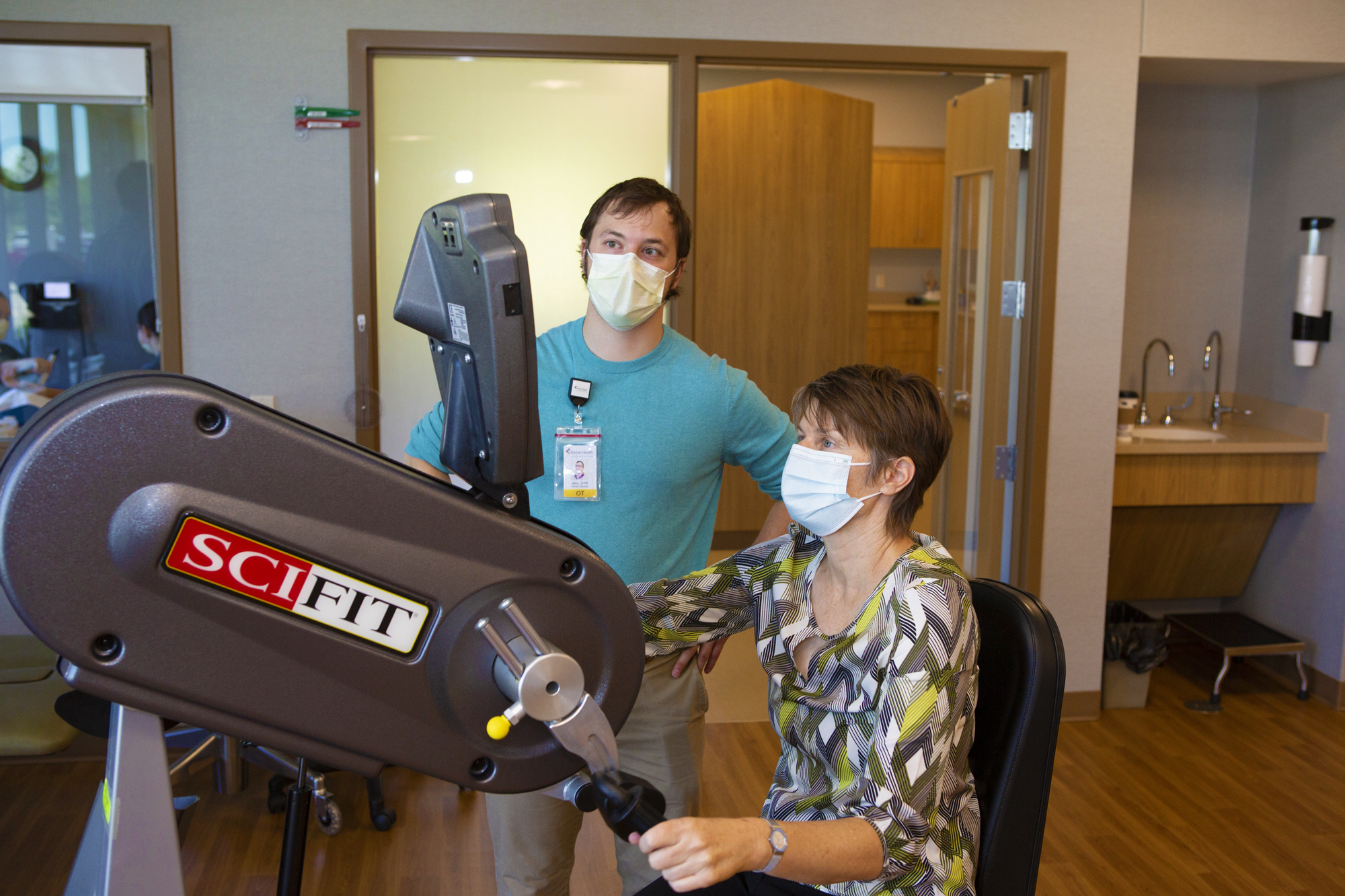 A Tomah Health physical therapist works with a patient in the state of the art exercise room at Tomah Health