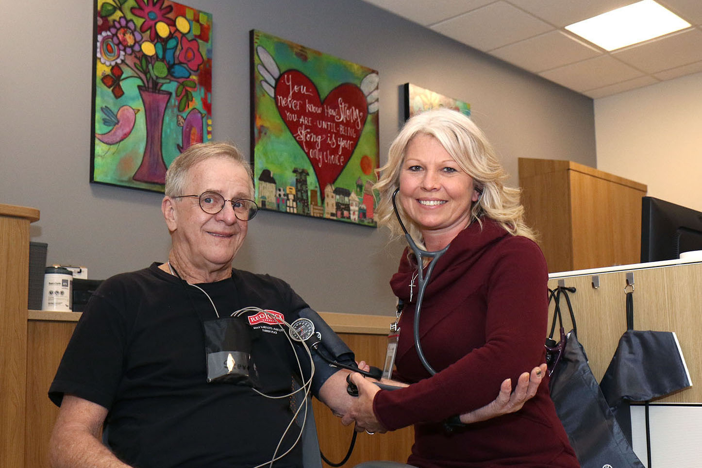 Cardia Rehab Coordinator Shana Steele checks vitals for Cardiac Rehab Patient Steve