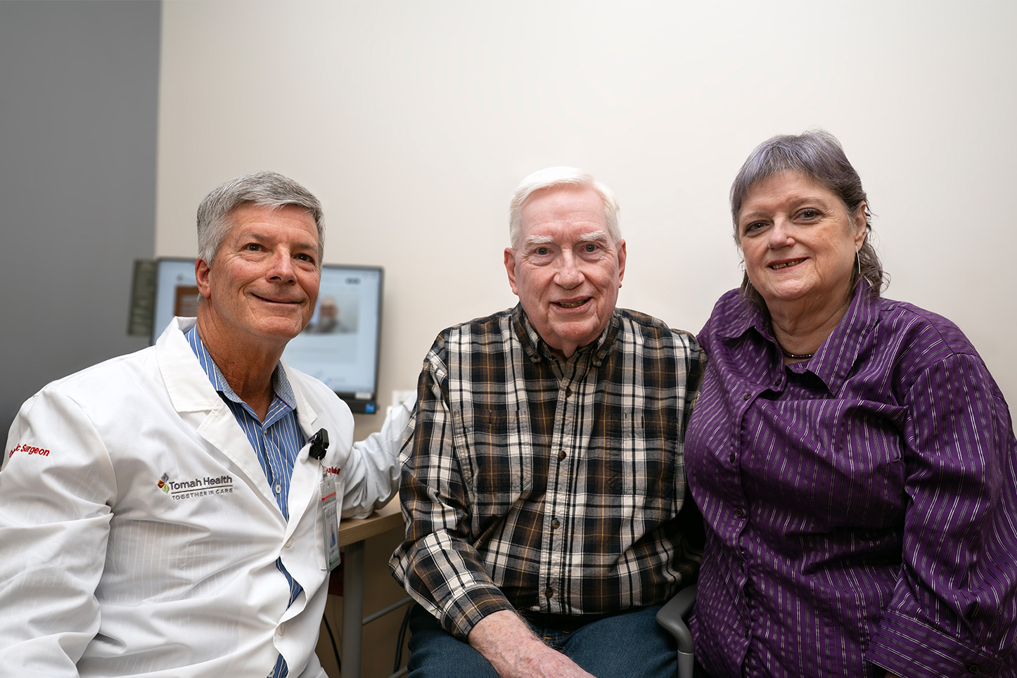 Tomah Health Orthopedic Surgeon Dr. Guy Rudin with patient Scott Westfahl of Tomah and patient spouse Deboralynn Westfahl.